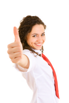 The photo shows a girl with her thumb up and a big smile on her face. her positive outlook is helping her to be successful in her approach to job hunting.